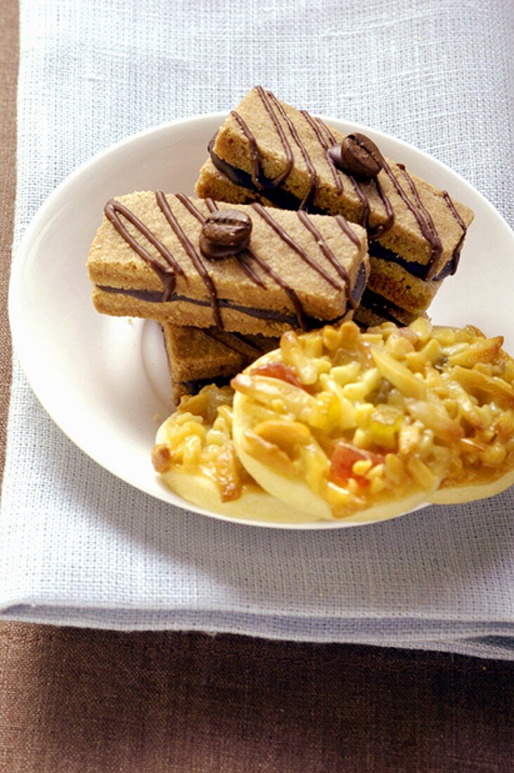 Espresso biscuits and Florentines on plate