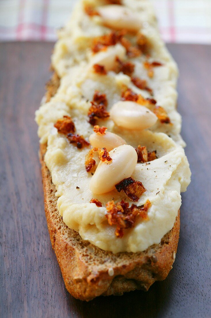 Baguette with bean paste and diced bacon