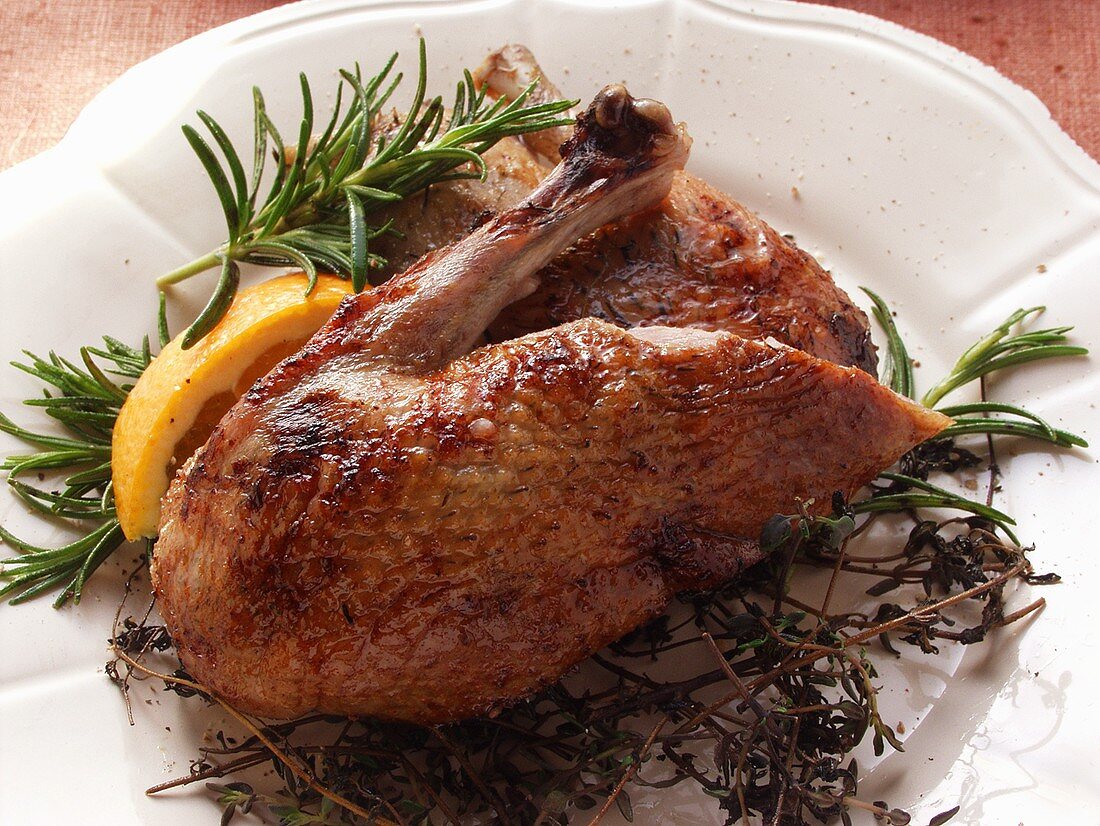 Roast legs of wild duck with herbs and lemon