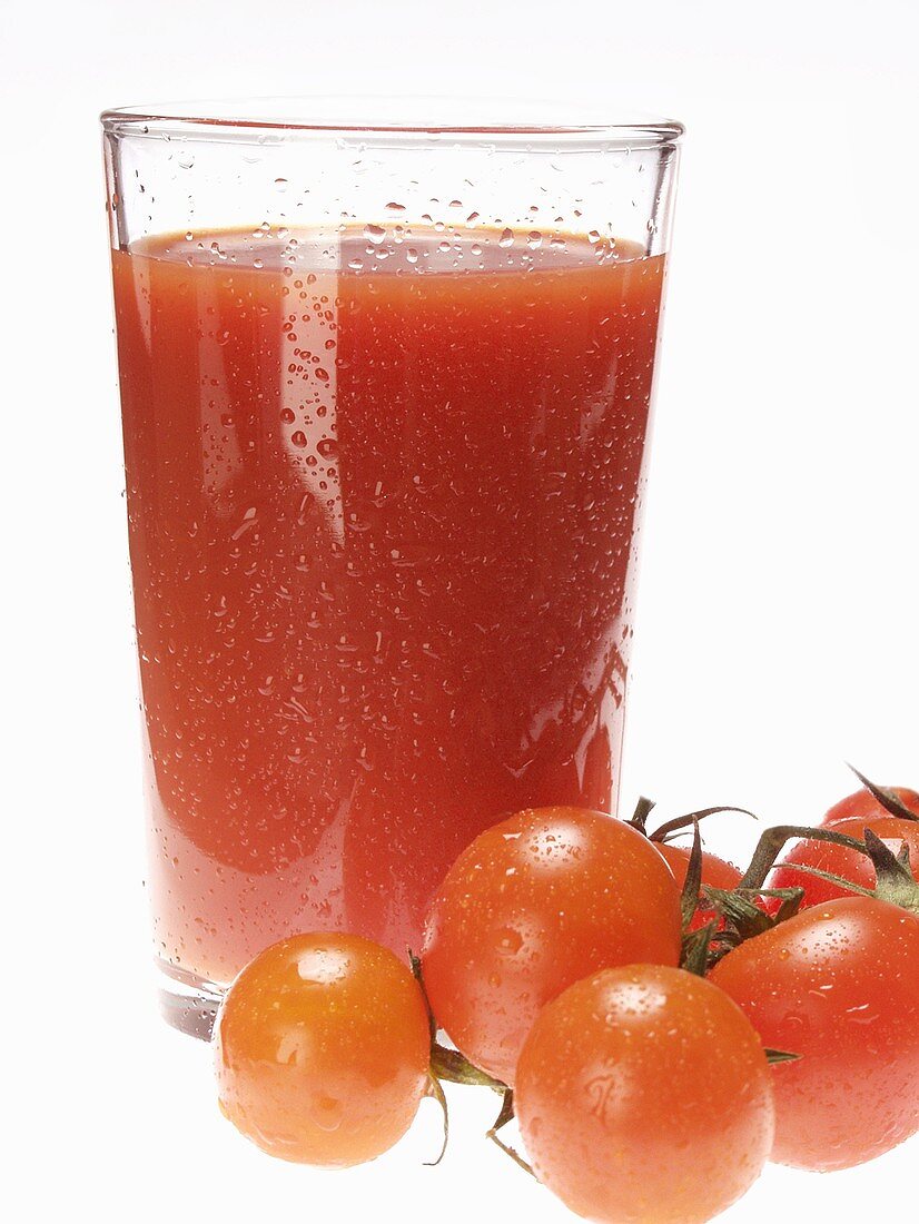 Glass of tomato juice and fresh cherry tomatoes