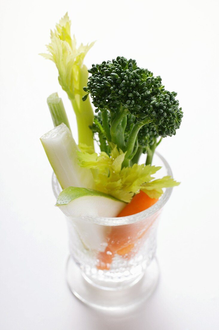 Celery, broccoli and carrots in glass