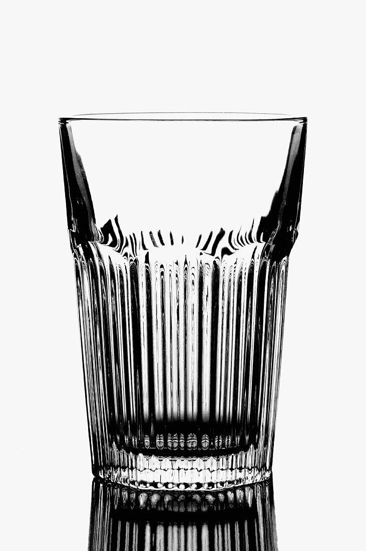 Empty water glass in black and white