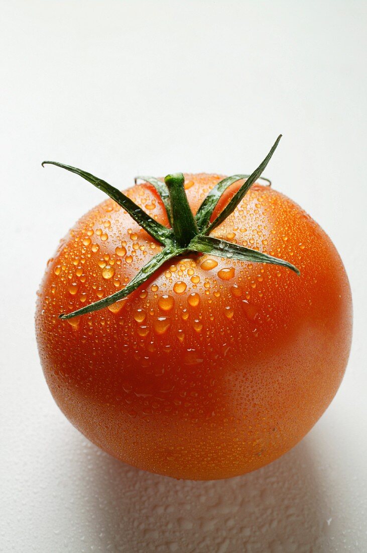 Tomato with drops of water