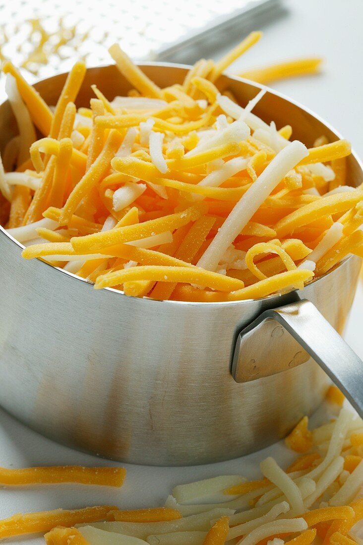 Mozzarella and Cheddar, grated in saucepan