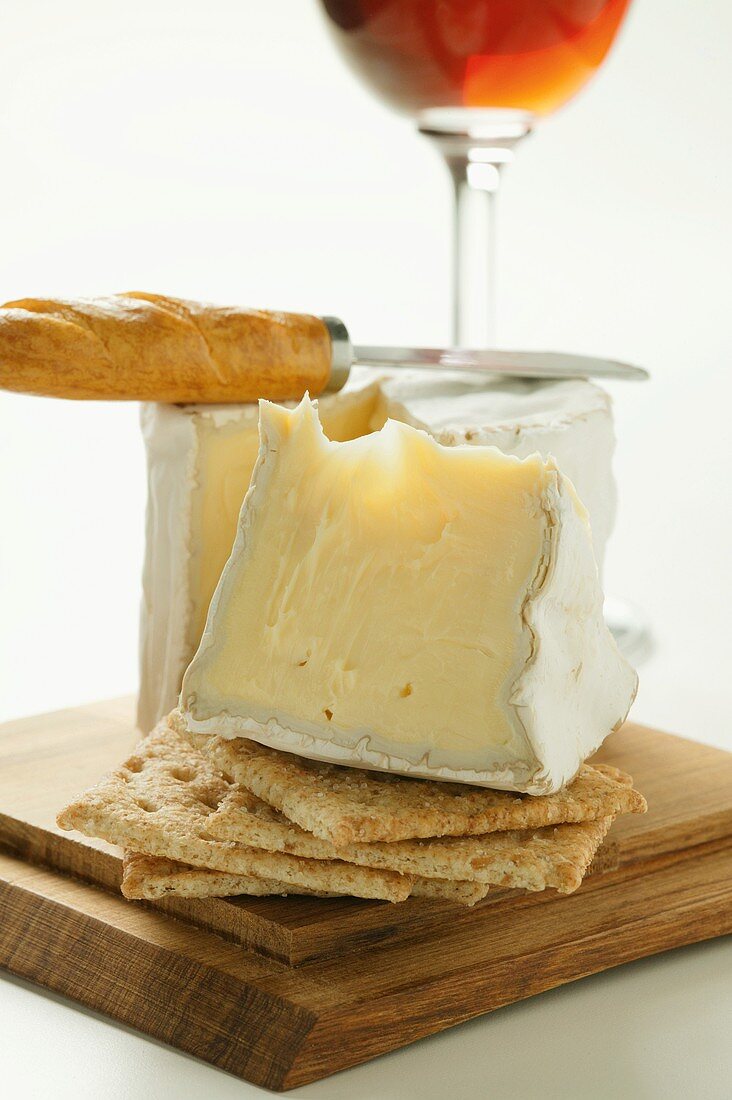 Saint Andre triple cream cheese with crackers and cheese knife