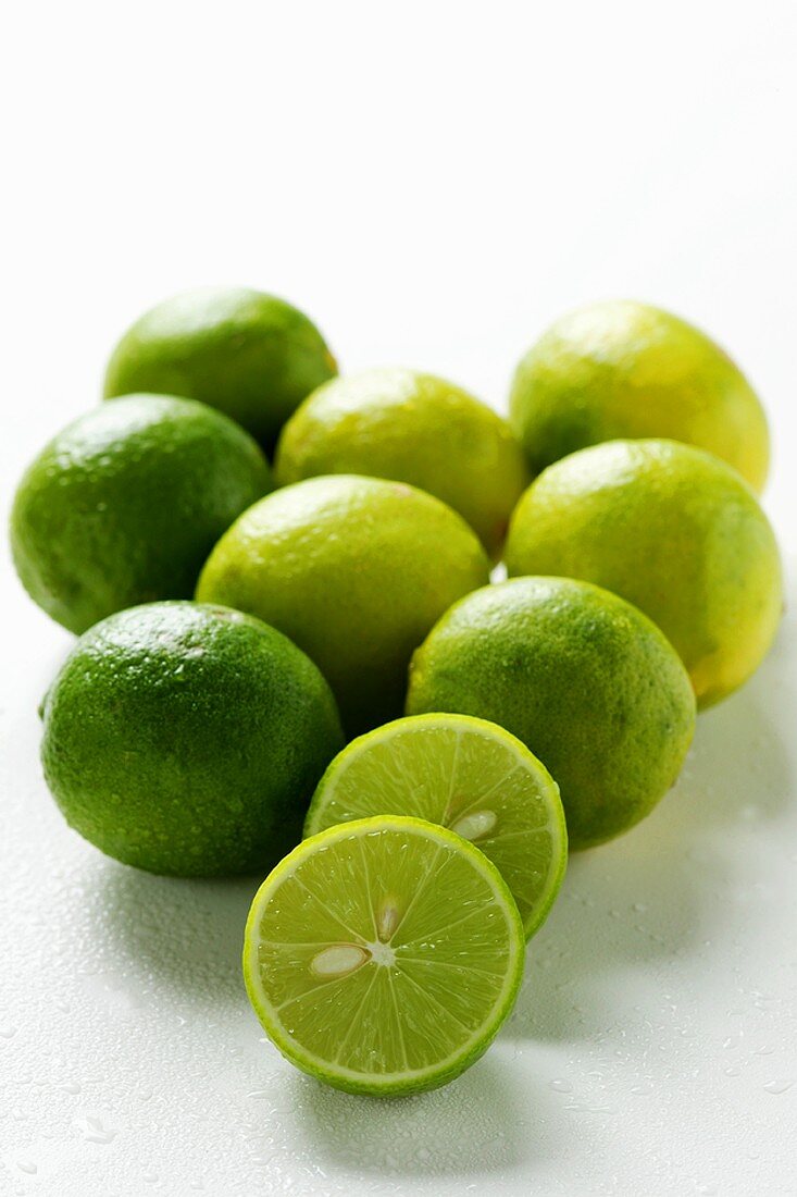 Fresh Key limes with drops of water