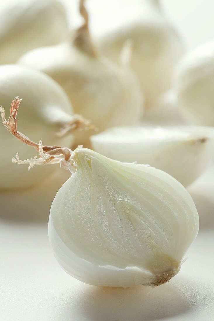 Small white onions, one halved
