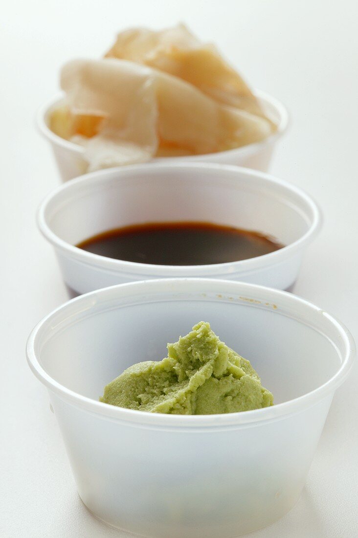 Sushi accompaniments: soy sauce, ginger and wasabi