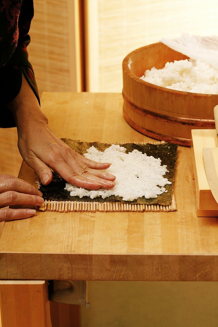 Preparing maki sushi