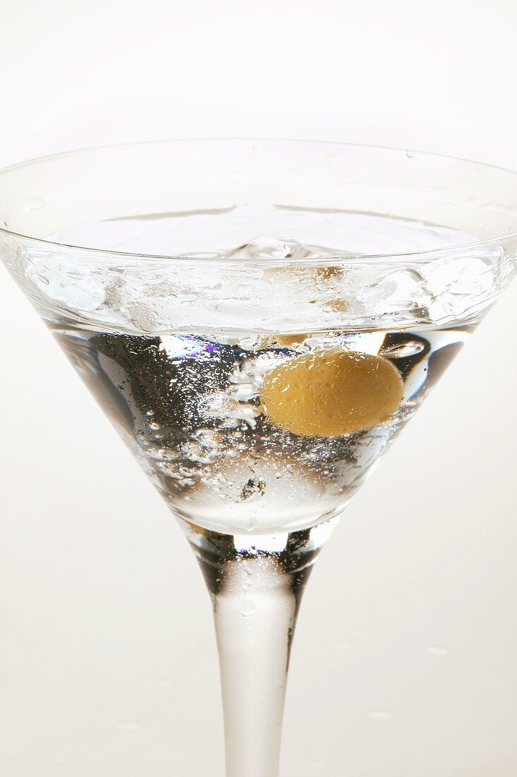 Martini with green olive