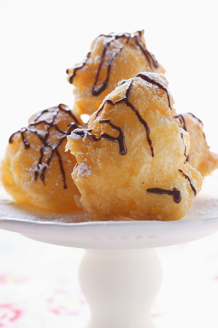 Chocolate doughnuts with icing sugar