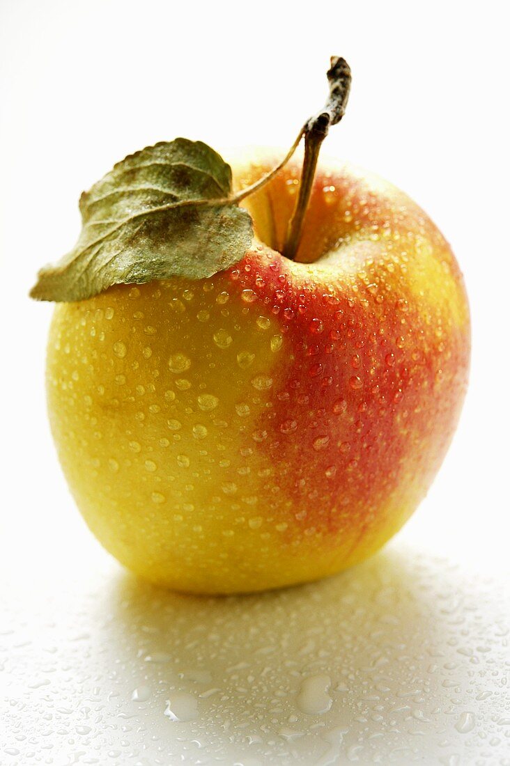 Fresh apple with drops of water