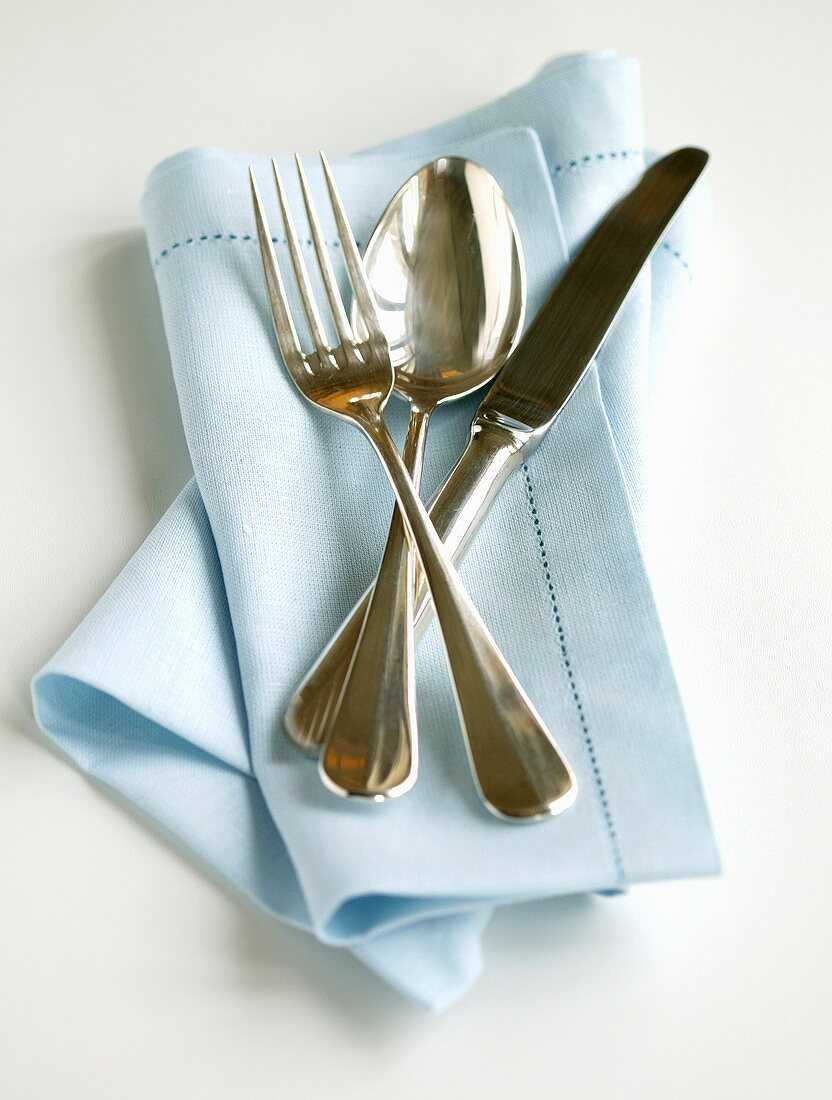 Cutlery on blue napkin