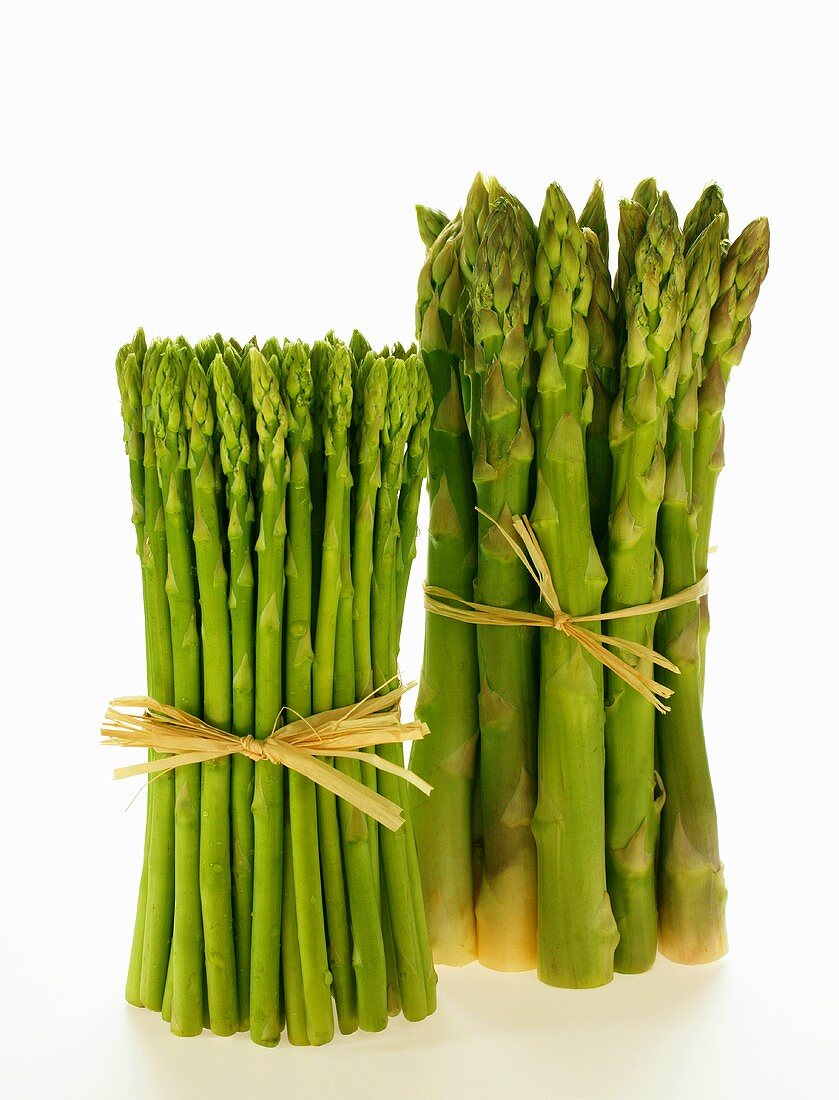 Bundle of green asparagus and bundle of Thai asparagus