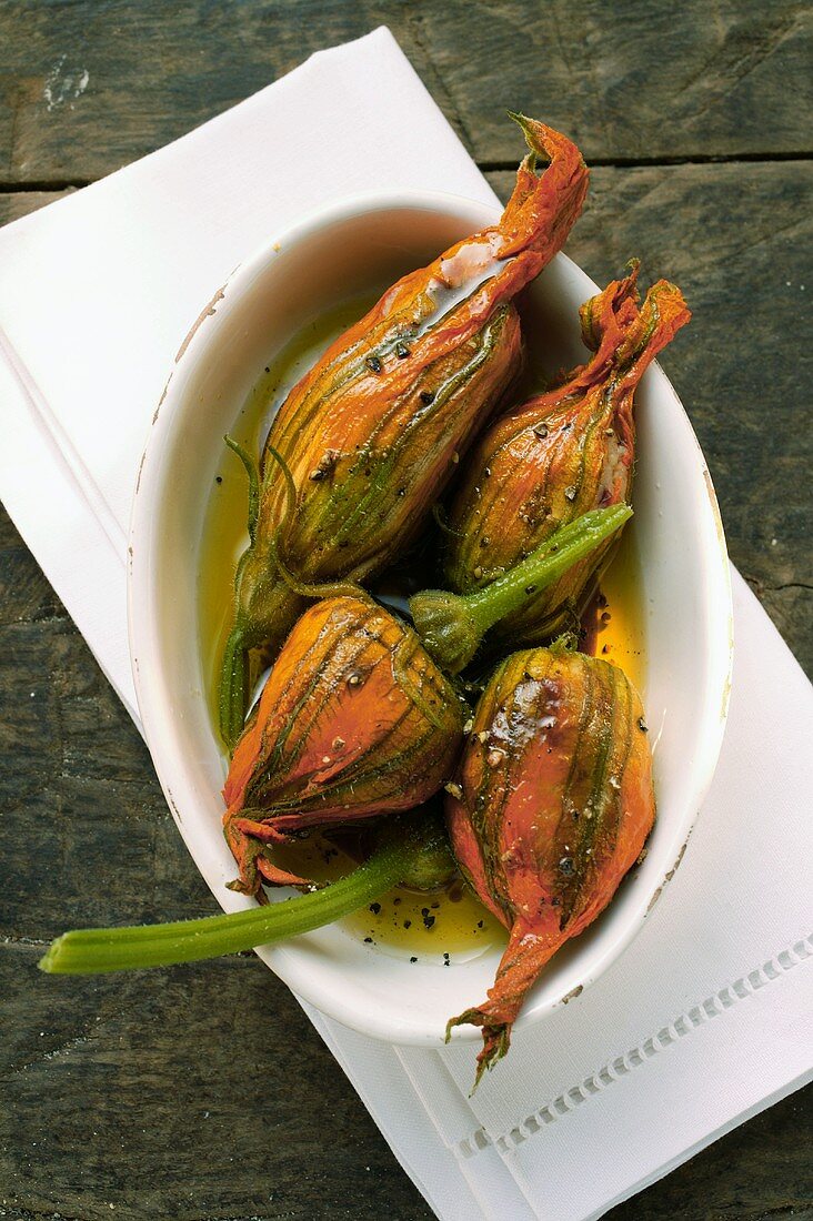 Marinated stuffed courgette flowers