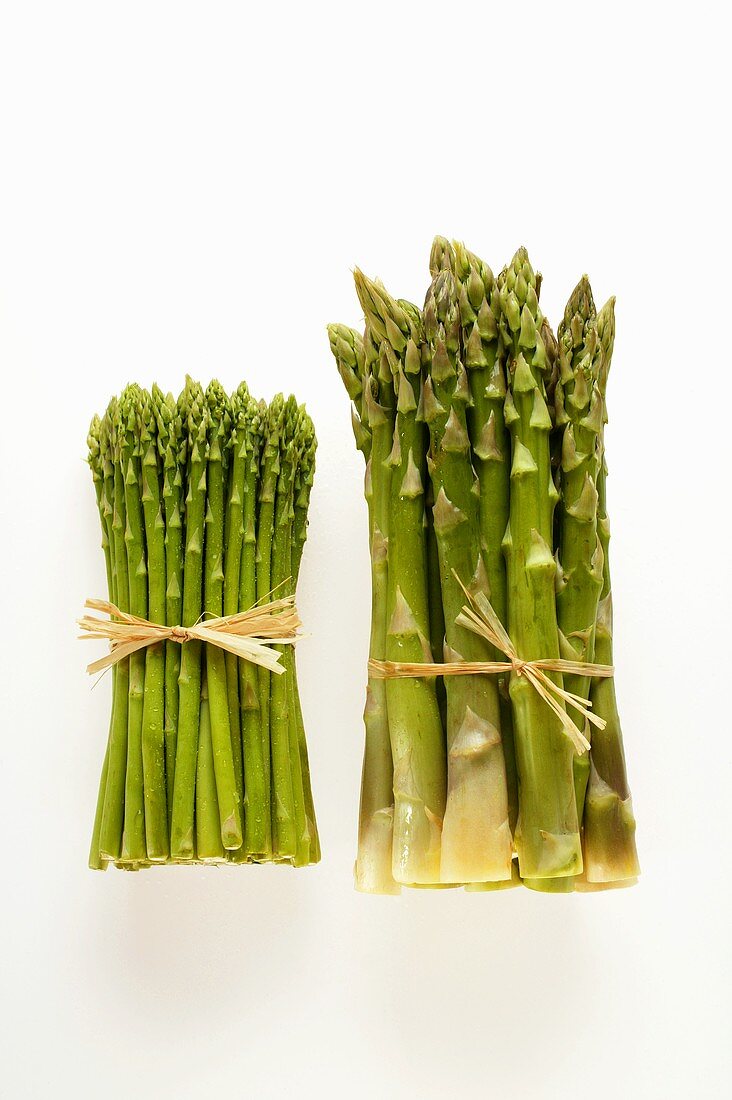 Different types of green asparagus in bundles