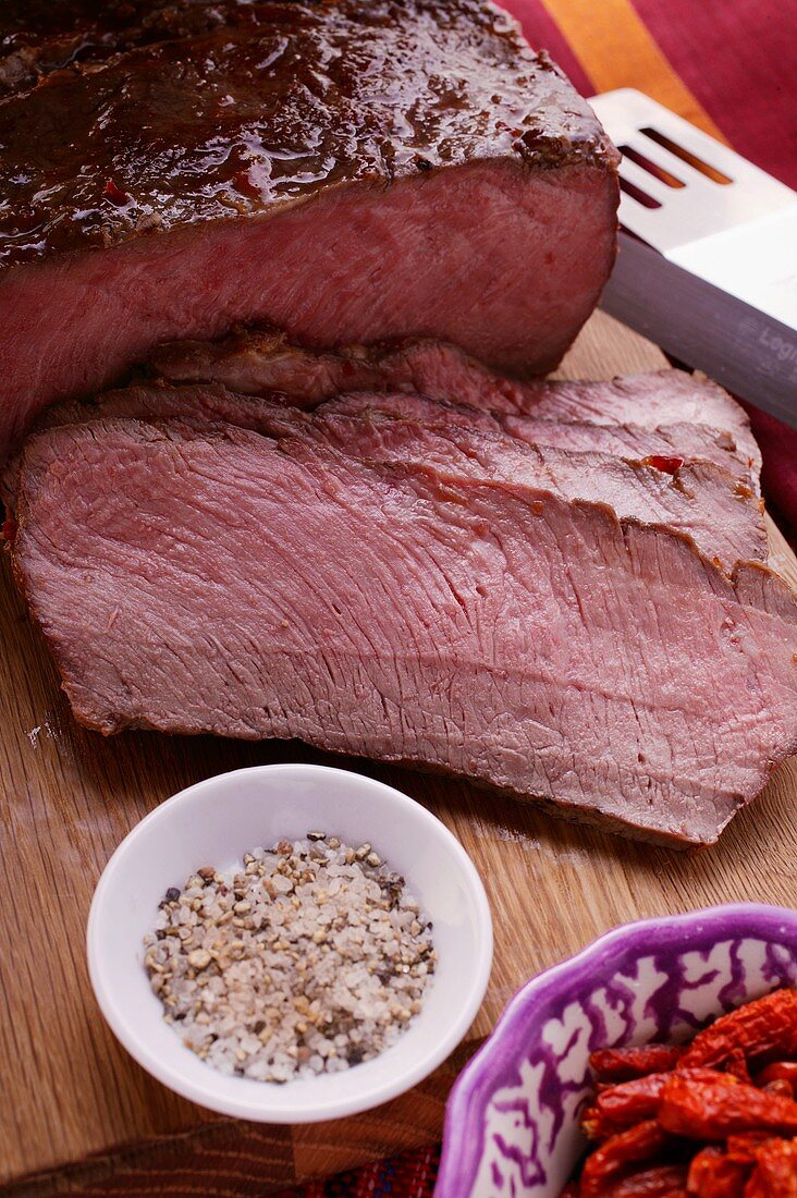 Roast beef on chopping board; spices