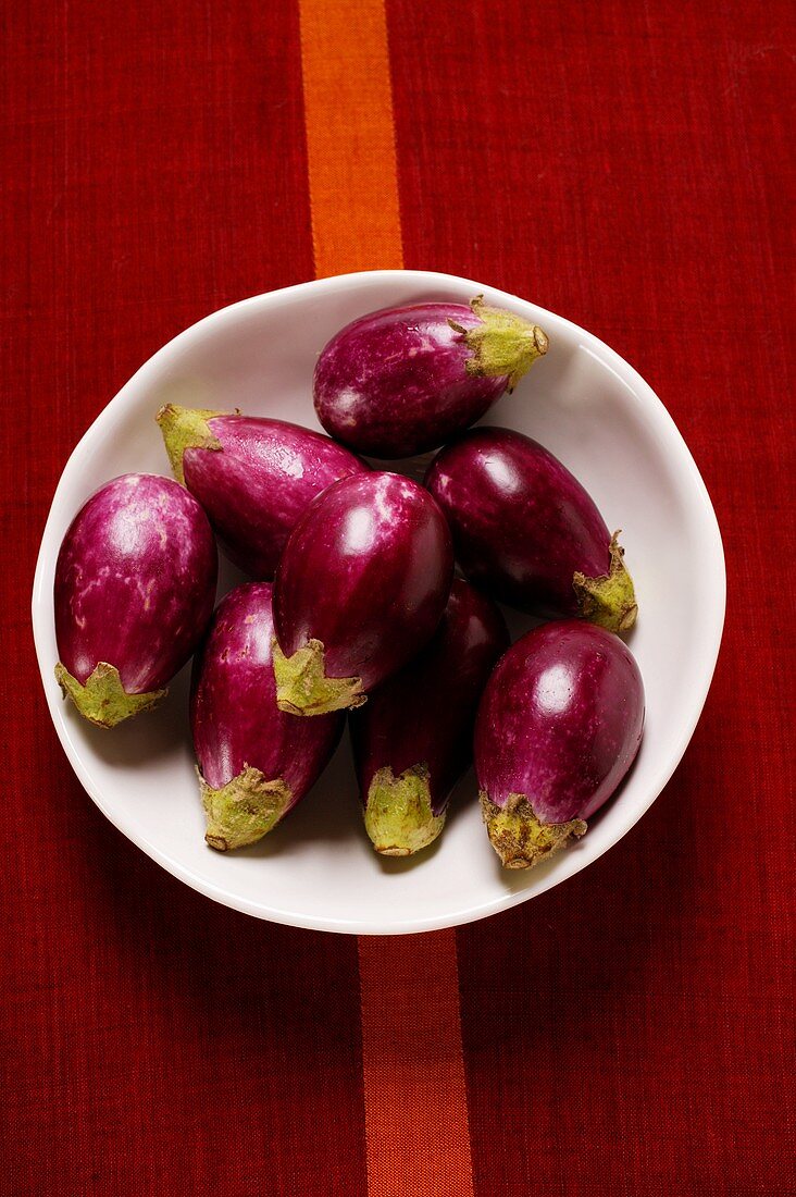 Mini-aubergines in bowl