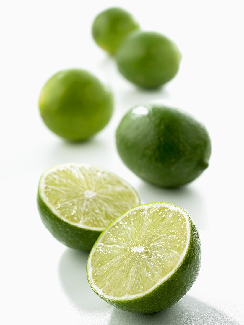 Limes, one halved