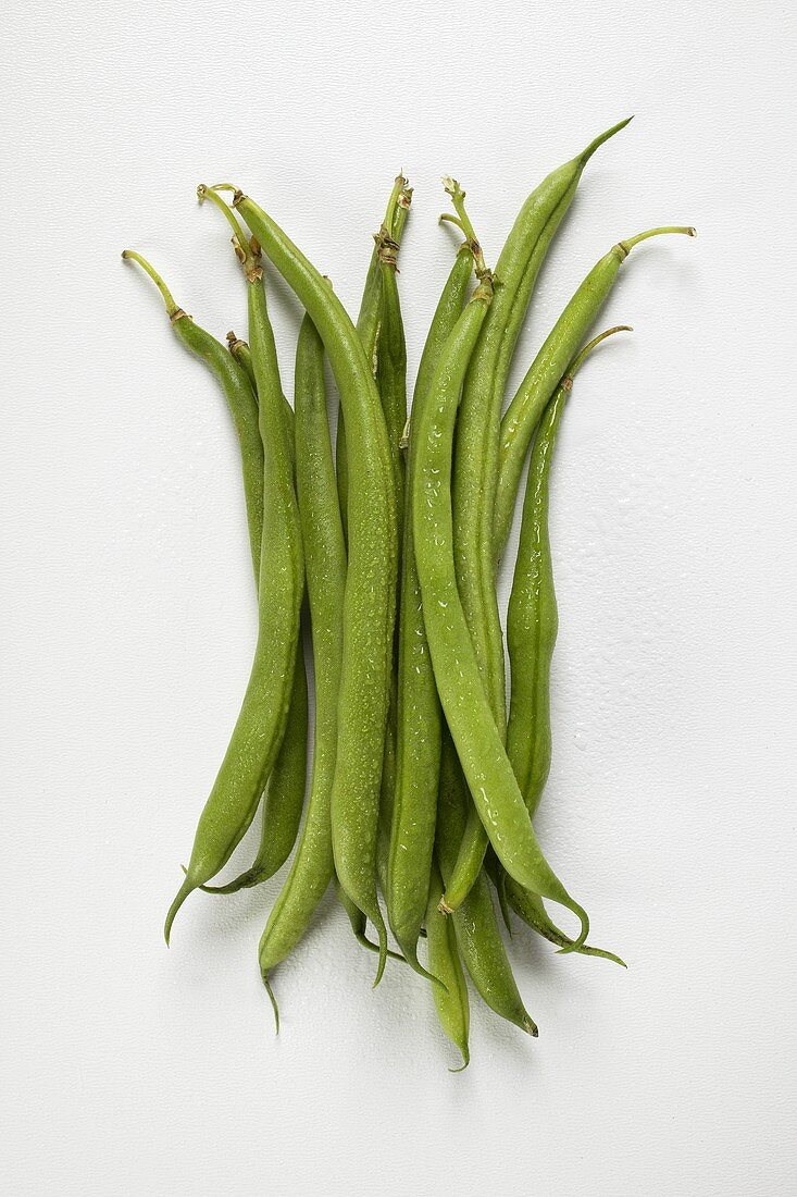 Fresh green beans with drops of water