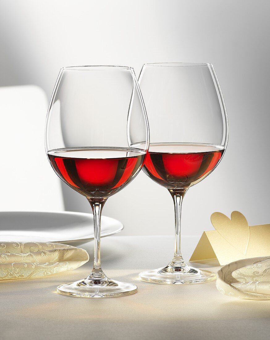 Two glasses of red wine on festive table