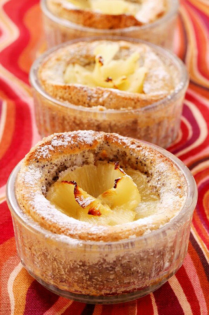 Pineapple and poppy seed soufflé in small glass dish
