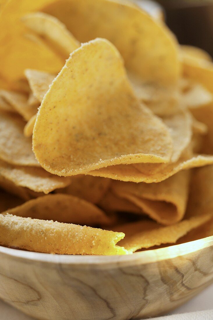 Tortilla chips in wooden bowl