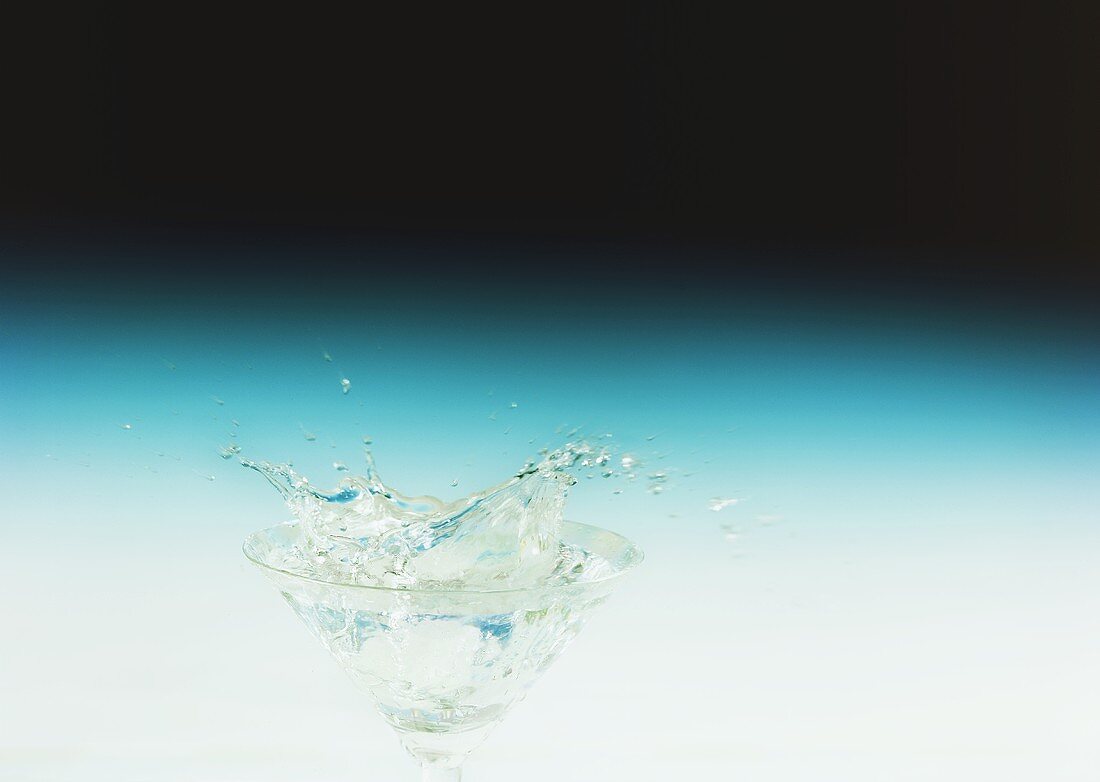 Water splashing out of a glass