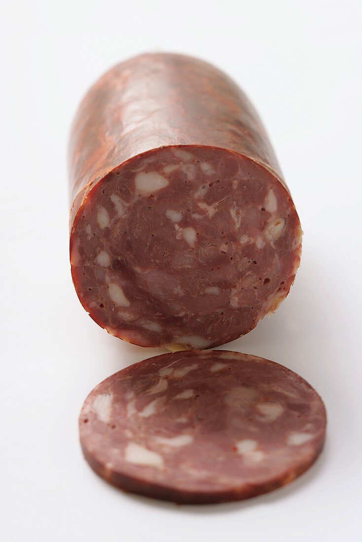 Spicy game sausage, a piece cut off