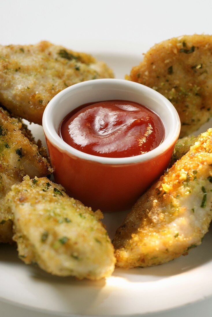 Chicken Nuggets in Kräuterpanade mit Ketchup