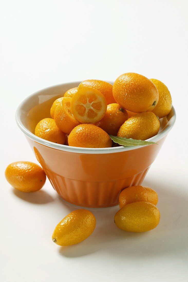 Kumquats in orange bowl