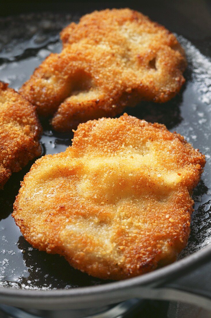 Wiener Schnitzel in frying pan