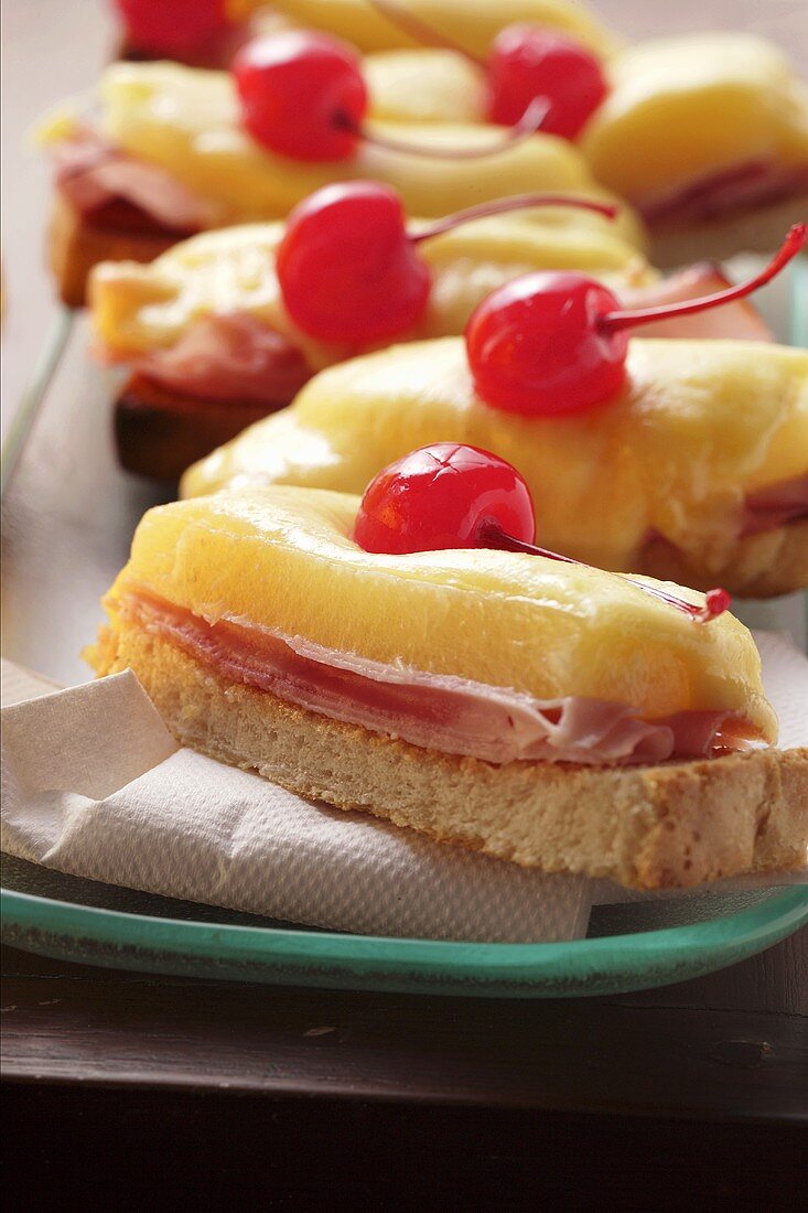 Ham and cheese on toast with cocktail cherry