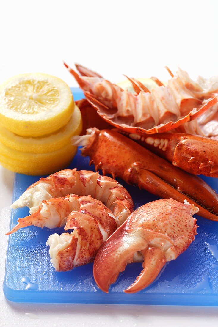 Lobster, cooked and prepared, with slices of lemon