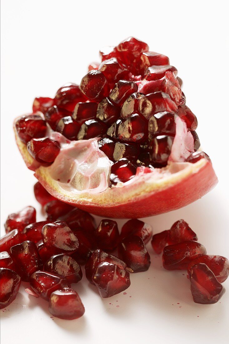 Piece of pomegranate and pomegranate seeds