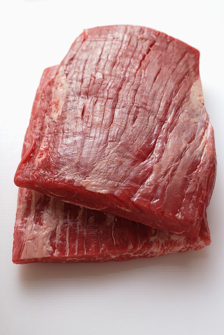 Raw flank steaks