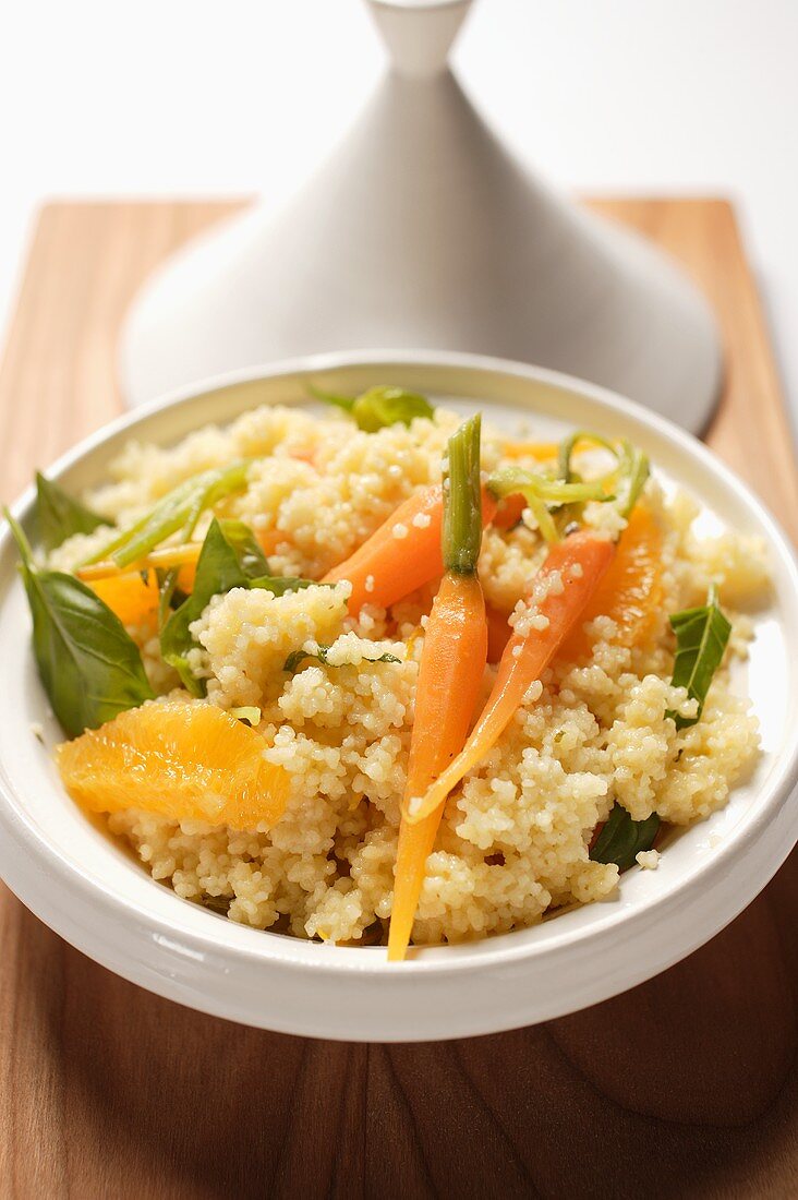 Couscous with carrots and oranges in tajine