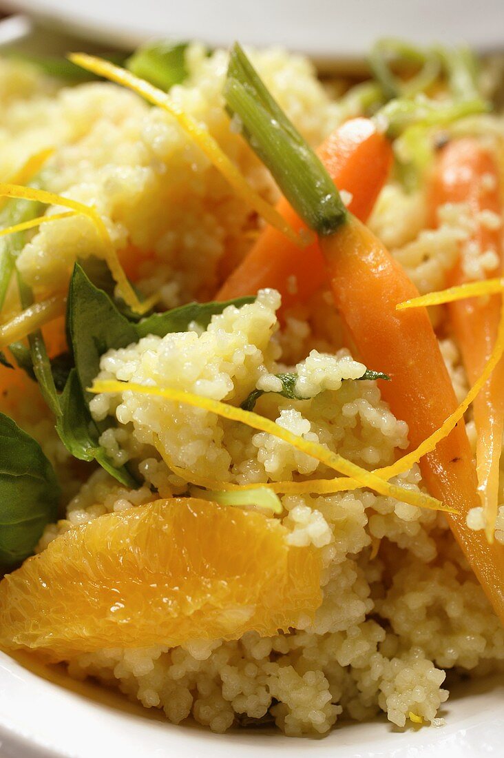 Couscous with carrots and oranges (close-up)