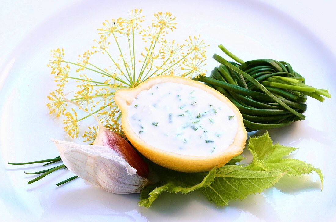 Garlic sauce in hollowed-out lemon; ingredients