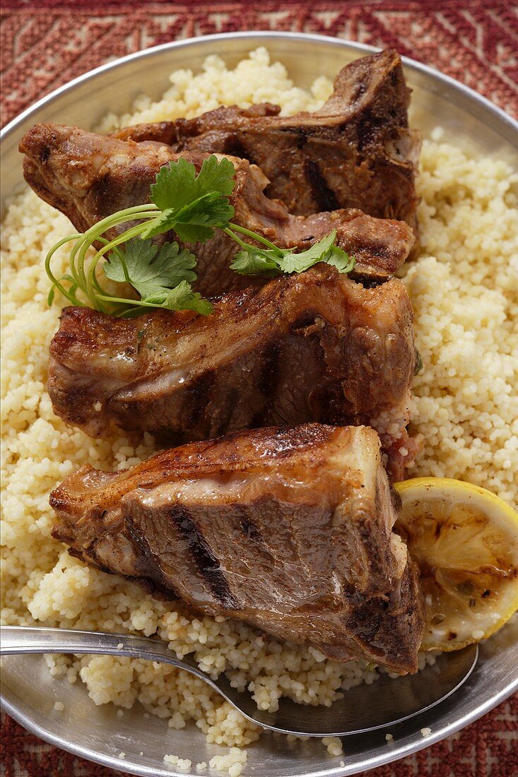 Grilled lamb chops on couscous (N. Africa)