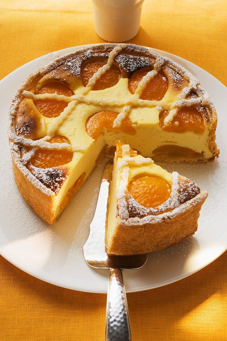 Apricot cheesecake, a piece cut