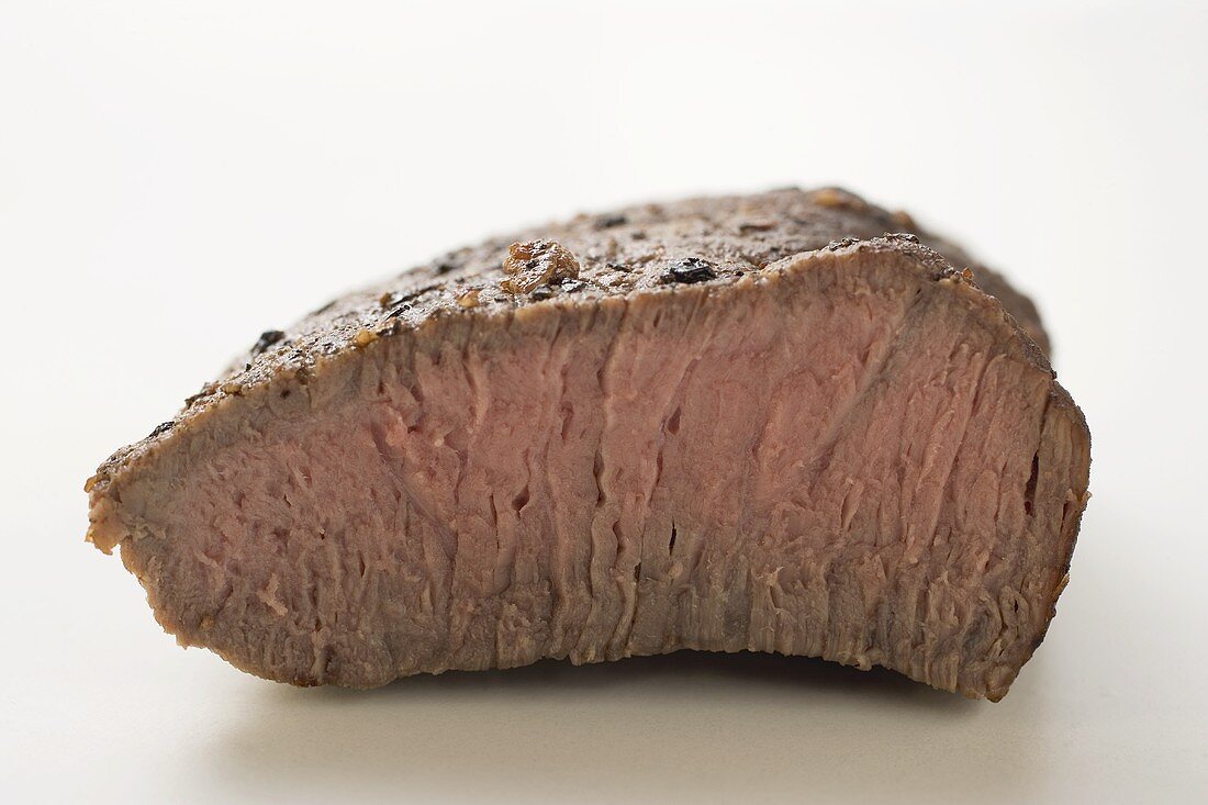 Beef steak with a piece cut off