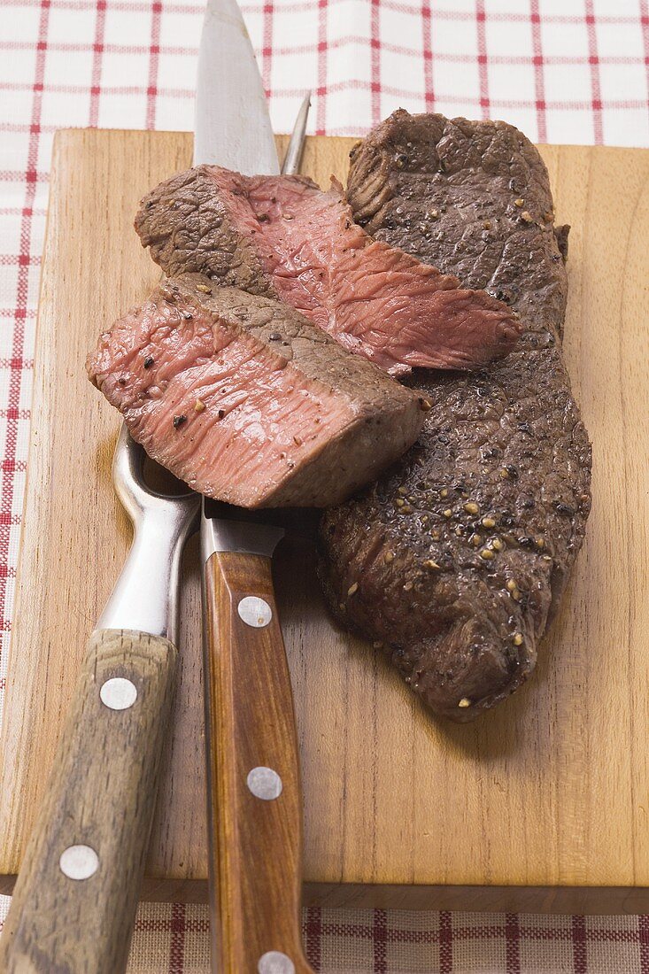 Beef steaks, partly sliced