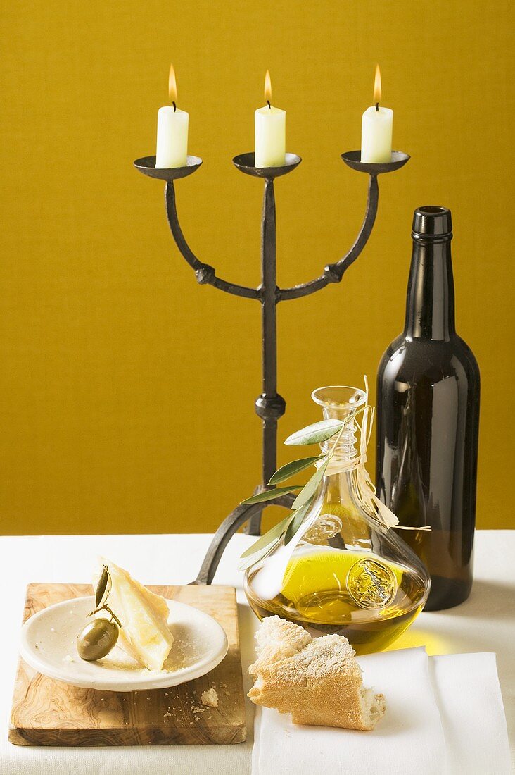 Olive, Parmesan, bread, olive oil, wine bottle, candlestick