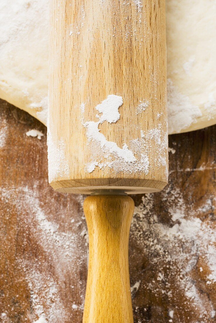Dough with rolling pin (close-up)