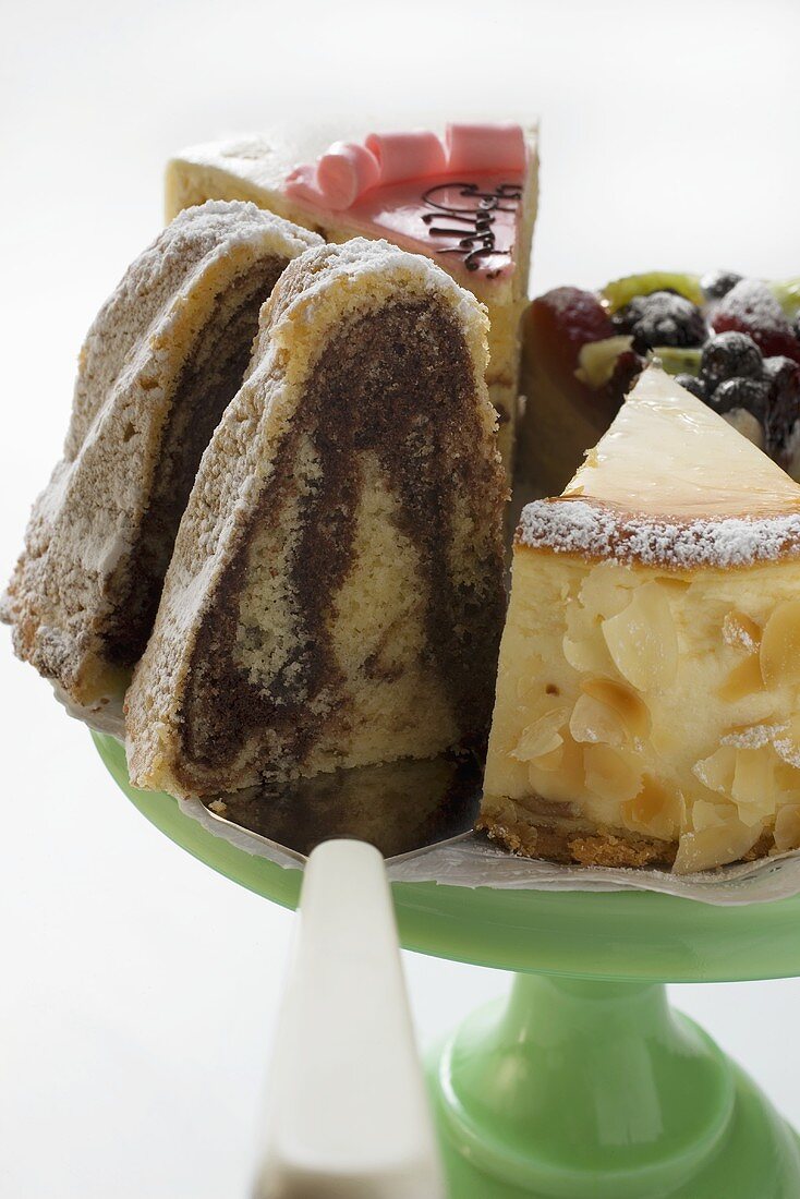 A selection of pieces of cake on cake stand