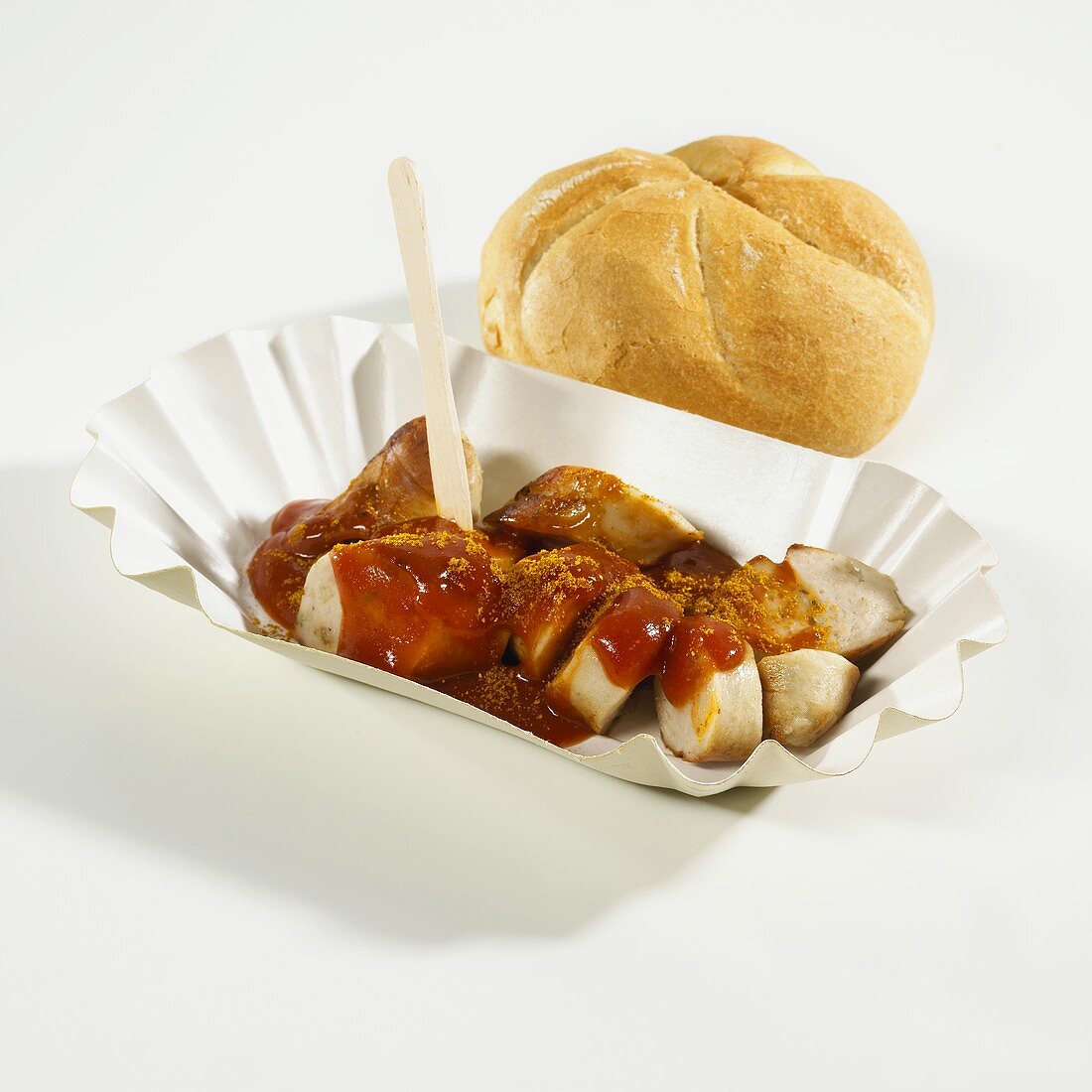 Currywurst (curry sausage) with bread roll