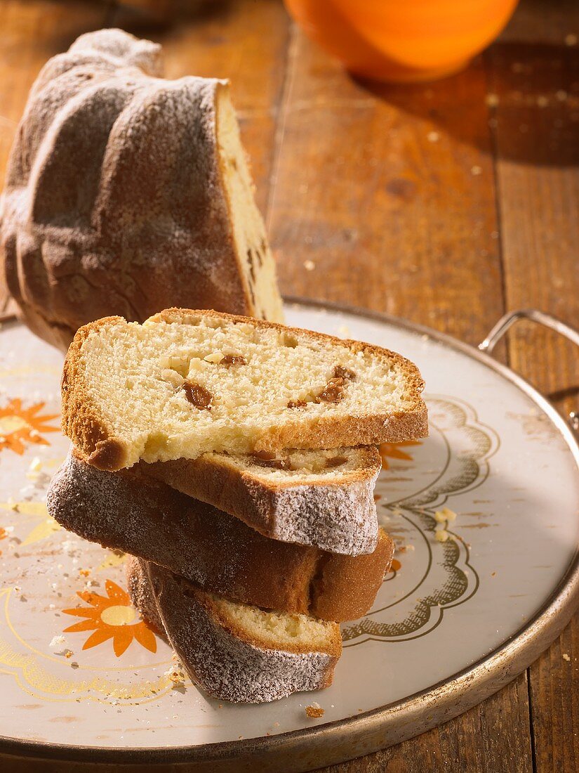 Gugelhupf, partly sliced, on tray