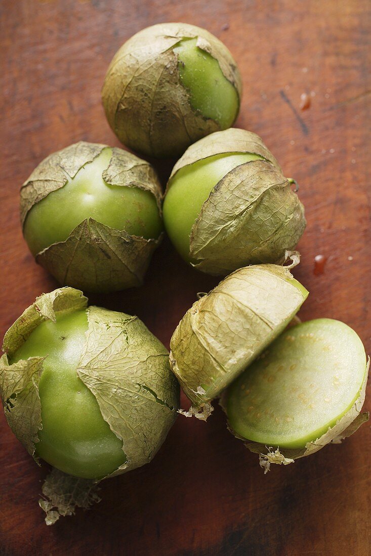 Several tomatillos, one cut open