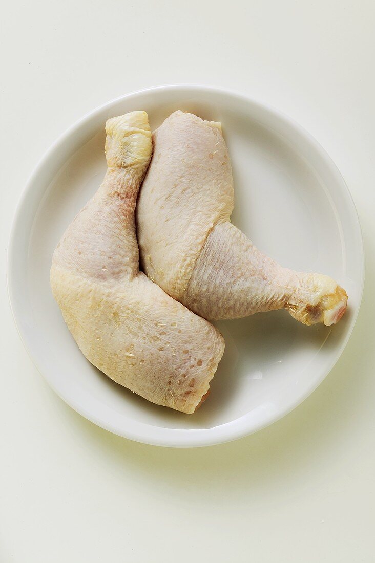 Two chicken legs on plate